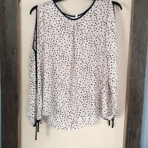 White blouse with black and red hearts